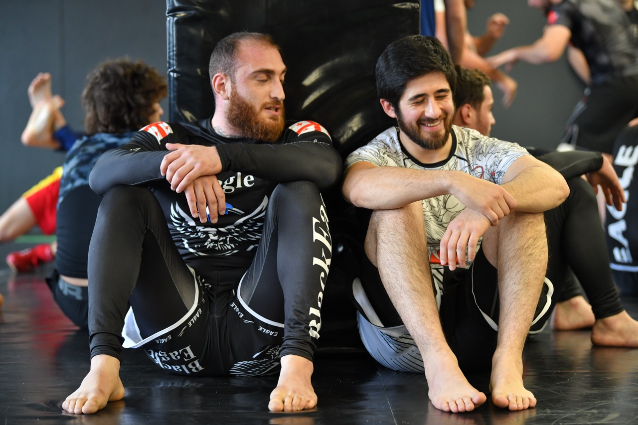 BJJ athletes drilling on the main mats